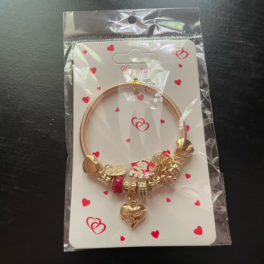 Hello Kitty Gold tone Charm Bracelet with Delicate Embellishments gold tone